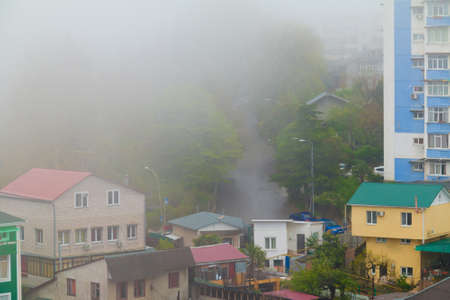 Aerial view of Nevskaya street and apartment buildings in the morning fog, Sochi, Russiaの写真素材