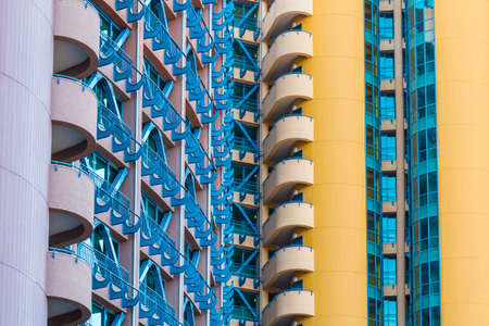 Many windows and balconies in a row on facade of urban apartment building front view, Sochi, Russiaの写真素材