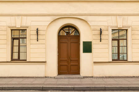 Door and windows on facade of urban office building front view, St. Petersburg, Russiaの写真素材