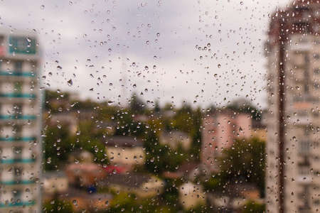 Aerial view of apartment buildings through the drops on the glass, Sochi, Russia