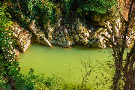High-angle view of Khosta River and rocks of the Devil's Gate Canyon in sunny autumn day, Sochi, Russiaの写真素材