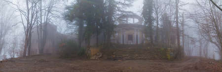 Panoramic view of the abandoned building of the former restaurant on the top of Mount Akhun in dense fog, Sochi, Russiaのeditorial素材