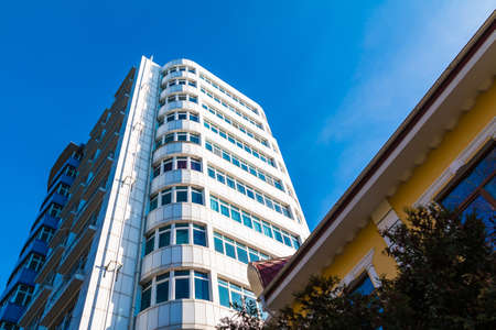Worm's-eye view of the high apartment building in sunny day, Sochi, Russia