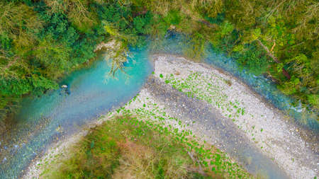 Top-down drone view of canyon and Khosta River in Yew and Box-tree Grove in spring day, Sochi, Russiaの写真素材