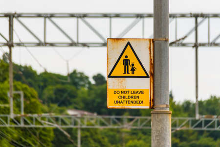 Railway sign 'Do not leave children unattended'の写真素材