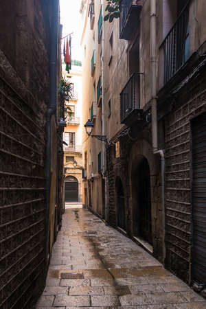 Perspective view of the narrow street in the Gothic Quarter, Barcelona, Spainの写真素材