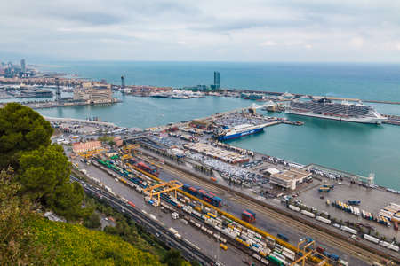 Barcelona, Spain - November 16, 2018: Aerial view of the Port of Barcelona and the Mediterranean Sea from the Montjuic mountain in overcast dayのeditorial素材