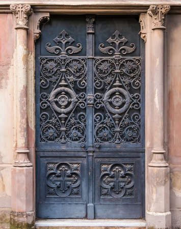 The wrought door of the stone crypt on the Montjuic Cemetery closeup front view, Barcelona, Catalonia, Spainの写真素材