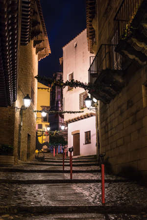 Barcelona, Catalonia, Spain - November 17, 2018: Beautiful night view of an illuminated street and buildings in the open-air Poble Espanyol architectural museumのeditorial素材
