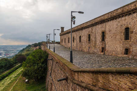 Barcelona, Spain - November 16, 2018: Perspective view of the pavement and fortress of the Montjuic Castle in overcast dayのeditorial素材