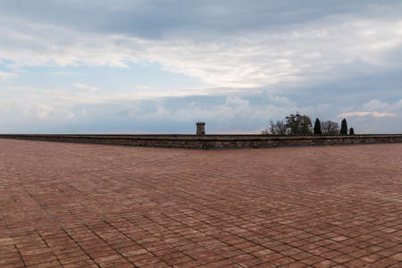 Barcelona, Catalonia, Spain - November 16, 2018: The upper area of the Montjuic Castle with pavement and the tower in the distance in cloudy dayのeditorial素材