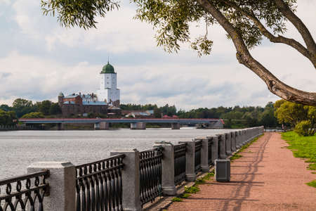 Embankment of Salakkalahti Bay on the background of the Vyborg Castle and the Petrovsky Bridge in cloudy day, Vyborg, Leningrad Oblast, Russiaの写真素材