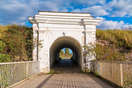 Ravelin Gate between stone walls and wooden bridge in sunny day, Annenkrone, Vyborg, Leningrad Oblast, Russiaの写真素材