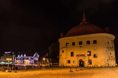 Vyborg, Leningrad Oblast, Russia - September 12, 2018: Beautiful view of the illuminated Market Square and the Round Tower at nightのeditorial素材