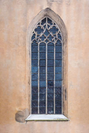 Window on the facade of the urban historic building front view, Tallinn, Estonia