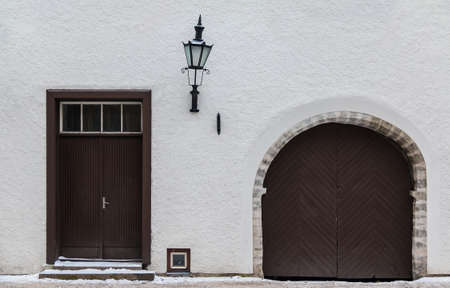 Door and gate on facade of the urban historic building front view, Tallinn, Estoniaの写真素材
