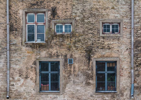Several windows on facade of the urban historic building front view, Tallinn, Estoniaの写真素材