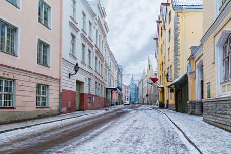 Perspective view of old buildings on the Pikk Street in overcast winter day, Tallinn Old Town, Estoniaの写真素材