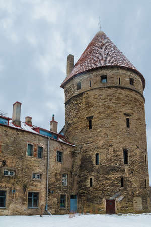 Low-angle view of the Loewenschede Tower in the Tallinn Old Town in snowy winter day, Estoniaの写真素材