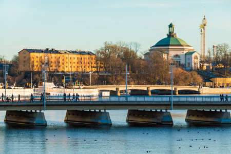 Stockholm, Sweden - December 26, 2018: The Strombron Bridge, the Skeppsholmsbron Bridge and historic buildings on embankment of the Norrstrom River in sunny winter dayのeditorial素材
