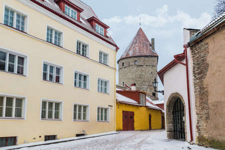 Perspective view of buildings on the Laboratooriumi Street and the Koismae Tower in overcast winter day, Tallinn Old Town, Estoniaの写真素材