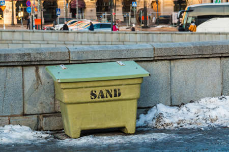 A container with sand closeup on the Norrbro Bridge in sunny winter day, Stockholm, Swedenの写真素材