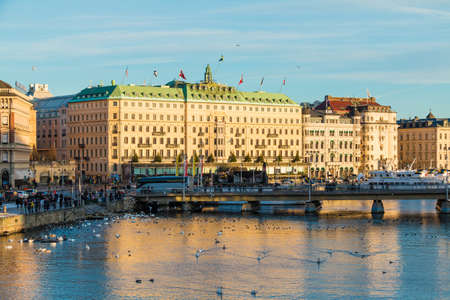 Stockholm, Sweden - December 26, 2018: Panoramic view of the Strombron Bridge and historic buildings on embankment of the Norrstrom River in sunny winter dayのeditorial素材