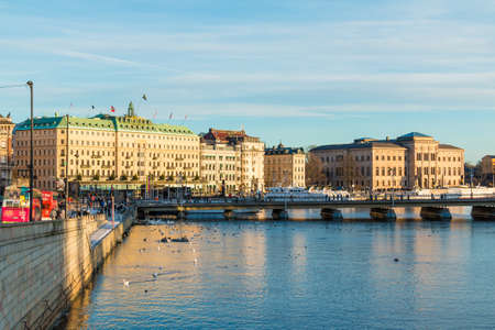 Stockholm, Sweden - December 26, 2018: Panoramic view of the Strombron Bridge and historic buildings on embankment of the Norrstrom River in sunny winter dayのeditorial素材