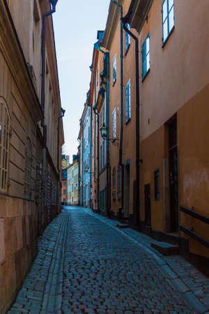 Perspective view of historical buildings on the Prastgatan Street in clear day, Stockholm, Swedenの写真素材