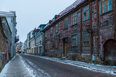 Tallinn, Estonia - December 25, 2018: Perspective view of buildings on the Uus street in the Tallinn Old Town in overcast winter day at twilightのeditorial素材