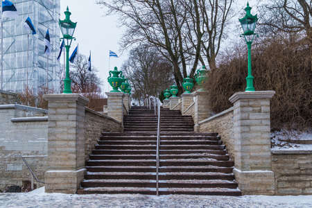 Low-angle view of the Mayer's Staircase on the Freedom Square in overcast winter day, Tallinn, Estoniaの写真素材