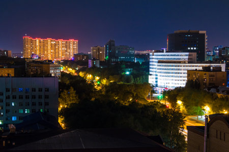 Beautiful aerial view of illuminated buildings and parks of the Tyumen City in sunny summer day at dusk, Tyumen, Russiaのeditorial素材