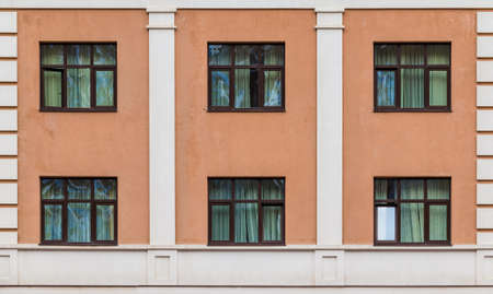 Several windows in a row on the facade of the modern urban apartment building front view, Krasnaya Polyana, Sochi, Krasnodar Krai, Russiaの写真素材