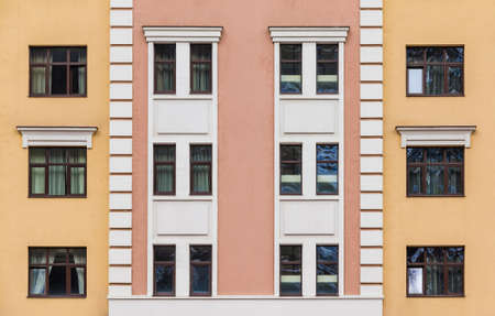 Many windows in a row on the facade of the modern urban apartment building front view, Krasnaya Polyana, Sochi, Krasnodar Krai, Russiaの写真素材