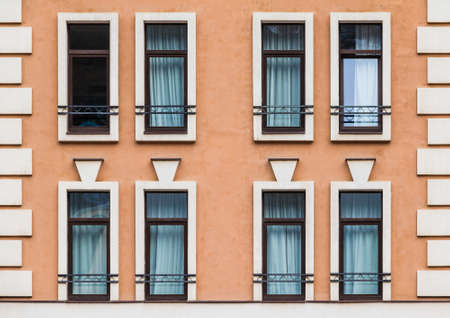 Several windows in a row on the facade of the modern urban apartment building front view, Krasnaya Polyana, Sochi, Krasnodar Krai, Russiaの写真素材