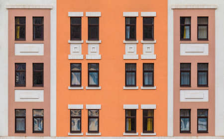 Many windows in a row on the facade of the modern urban apartment building front view, Krasnaya Polyana, Sochi, Krasnodar Krai, Russiaの写真素材