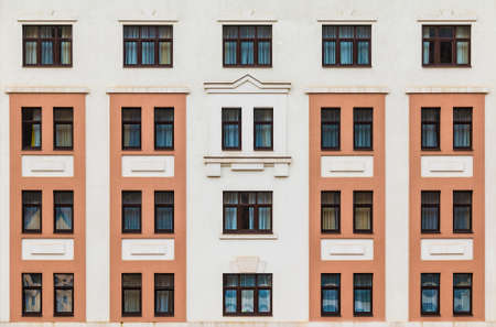 Many windows in a row on the facade of the modern urban apartment building front view, Krasnaya Polyana, Sochi, Krasnodar Krai, Russiaの写真素材
