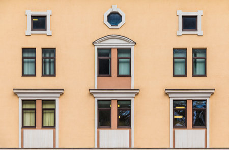 Many windows in a row on the facade of the modern urban apartment building front view, Krasnaya Polyana, Sochi, Krasnodar Krai, Russiaの写真素材