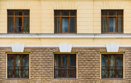 Several windows in a row on the facade of the modern urban apartment building front view, Krasnaya Polyana, Sochi, Krasnodar Krai, Russiaの写真素材