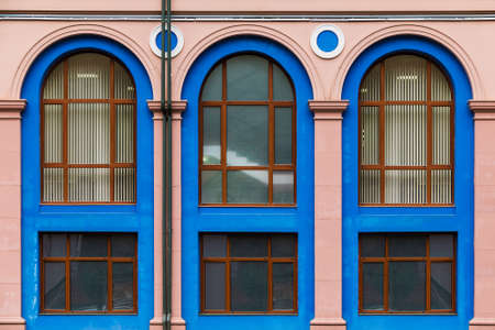 Several windows in a row on the facade of the modern urban apartment building front view, Krasnaya Polyana, Sochi, Krasnodar Krai, Russiaの写真素材