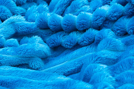 Blurred blue blanket background. Crumpled terry bedspreadの写真素材