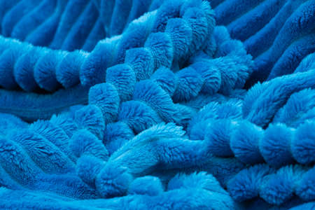 Blurred blue blanket background. Crumpled terry bedspread.の写真素材