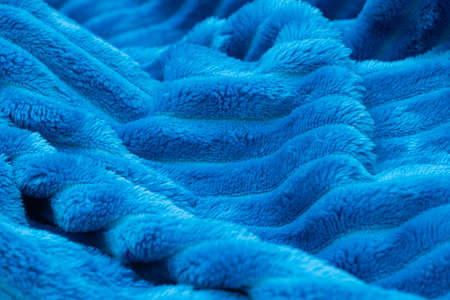 Blurred blue blanket background. Crumpled terry bedspreadの写真素材