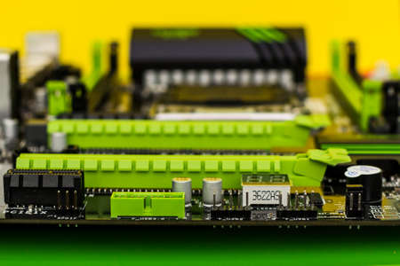 Motherboard closeup with blurry background. Computer components of the system unit.の写真素材