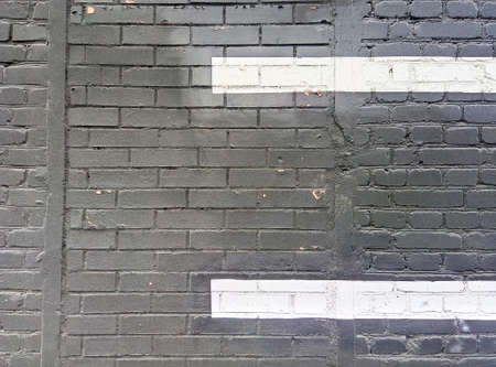 Background of Black brick and wahite strip wall pattern texture.の写真素材