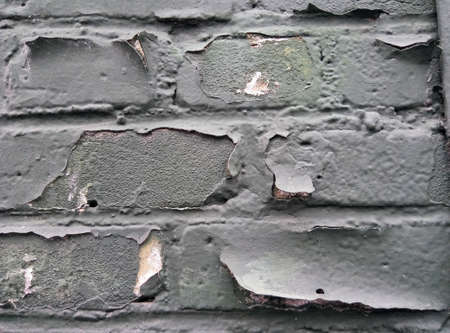 Background of black glossy painted brick wall pattern texture.の写真素材