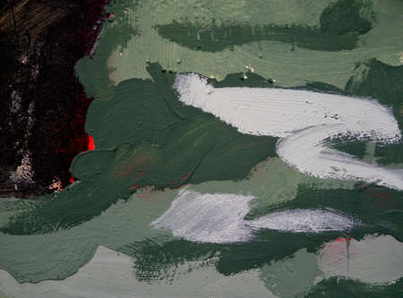 Fragment of a painted metal fence. Stains of paint. Wall texture.の写真素材