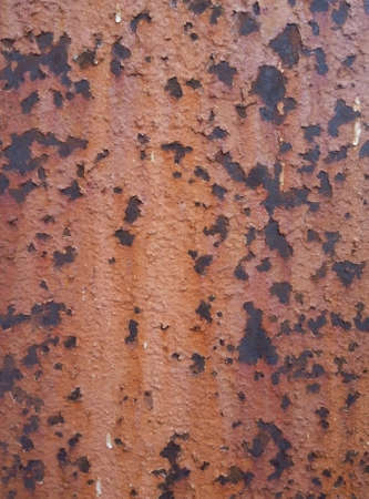 Textured old metal sheet with peeling paint and a little rust.の写真素材