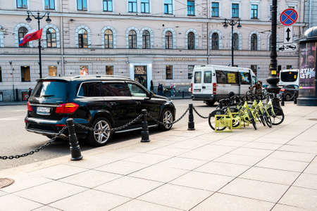 St. Petersburg, Russia, 04.05.2021: Mercedes GL350 on the street, bicycles for rent. Street car parking.のeditorial素材