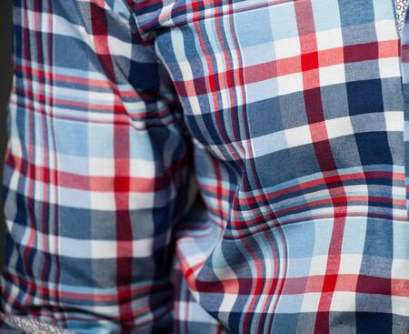 Checked pattern on a cotton shirt   Shallow DOF, focused on right
